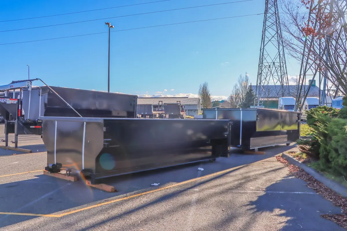 Roll-off dumpster ready for waste disposal at job site for Concrete Dumpster Rental in Orange
